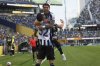 Botafogo's Jair Cunha celebrates after scoring the opening goal with Alex Telles, top, during the Club World Cup group B soccer match between Botafogo and Seattle Sounders at Seattle Lumen Field, in Seattle, Sunday, June 15, 2025.(AP Photo/Ryan Sun)