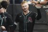 Arizona Diamondbacks' Pavin Smith celebrates with teammates after hitting a solo home run during the fourth inning of a baseball game against the Chicago White Sox in Chicago, Monday, June 23, 2025. (AP Photo/Nam Y. Huh)