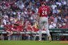 Cincinnati Reds pitcher Chase Burns heads to the dugout after being pulled during the first inning of a baseball game against the Boston Red Sox at Fenway Park, Monday, June 30, 2025, in Boston. (AP Photo/Charles Krupa)