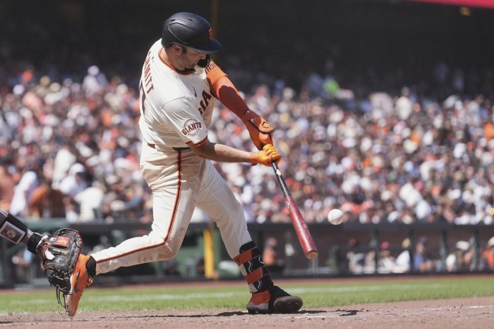 San Francisco Giants' Casey Schmitt hits a single against the Boston Red Sox during the eighth inning of a baseball game in San Francisco, Sunday, June 22, 2025. (AP Photo/Jeff Chiu)