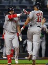Boston Red Sox's Rafael Devers (11) celebrates with Wilyer Abreu after hitting a home run during the ninth inning of a baseball game against the New York Yankees , Sunday, June 8, 2025, in New York. (AP Photo/Noah K. Murray)