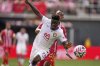 Al Ain's Abdoul Karim Traore and Wydad AC's Selemani Mwalimu chae the ball during the Club World Cup Group G soccer match between Wydad AC and Al Ain FC in Washington, Thursday, June 26, 2025. (AP Photo/Julia Demaree Nikhinson)