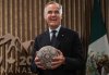 Canadian Prime Minister Mark Carney holds a soccer ball with beaded Huichol art on it after being gifted it by Mexican President Claudia Sheinbaum, not seen, before a meeting at the G7 Summit in Kananaskis, Alta., on Tuesday, June 17, 2025. THE CANADIAN PRESS/Darryl Dyck