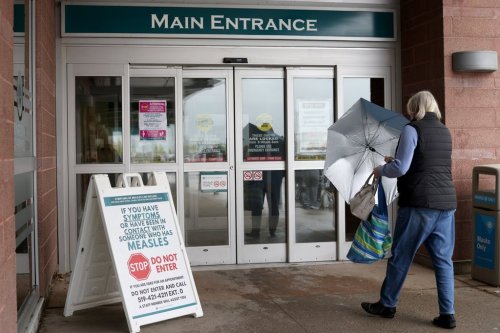 Warning signage for suspected cases of measles is seen outside the main entrance of Woodstock General Hospital in Woodstock, Ont., Thursday, May 22, 2025. THE CANADIAN PRESS/Nicole Osborne