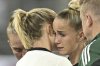 Germany's Giulia Gwinn, center, reacts as she has to leave the pitch during the UEFA Women's EURO 2025 Group C soccer match between Germany and Poland at the Kybunpark stadium in St. Gallen, Switzerland, on Friday, July 4, 2025. (Gian Ehrenzeller/Keystone via AP)
