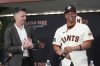 San Francisco Giants' Rafael Devers, right, smiles next to President of Baseball Operations Buster Posey at a news conference before a baseball game between the Giants and the Cleveland Guardians in San Francisco, Tuesday, June 17, 2025. (AP Photo/Jeff Chiu)