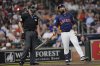 Houston Astros' Luis Guillorme, right, reacts after a strike-three call by home plate umpire Lance Barrett during the second inning of a baseball game against the Chicago Cubs Sunday, June 29, 2025, in Houston. (AP Photo/David J. Phillip)