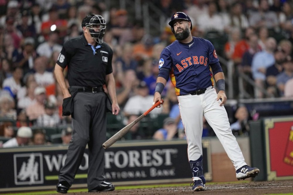 Houston Astros' Luis Guillorme, right, reacts after a strike-three call by home plate umpire Lance Barrett during the second inning of a baseball game against the Chicago Cubs Sunday, June 29, 2025, in Houston. (AP Photo/David J. Phillip)