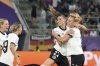 Germany's Jule Brand, 2nd right, celebrates after scoring the opening goal during the Euro 2025, group C, soccer match between Germany and Poland at Arena St. Gallen in St. Gallen, Switzerland, Friday, July 4, 2025. (AP Photo/Martin Meissner)