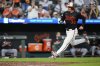 Baltimore Orioles' Adley Rutschman (35) advances toward home plate to score on an RBI hit in by Gunnar Henderson during the seventh inning of a baseball game against the Detroit Tigers, Wednesday, June 11, 2025, in Baltimore. (AP Photo/Stephanie Scarbrough)