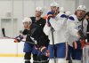 Edmonton Oilers defenceman Darnell Nurse, left, looks up ice during practice at the NHL Stanley Cup final in Fort Lauderdale, Fla., on Tuesday, June 10, 2025. THE CANADIAN PRESS/Nathan Denette