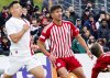Olympiacos' Charalampos Kostoulas, right, in action during the Youth League Final against AC Milan at the Colovray Sports Centre in Nyon, Switzerland, Monday, April 22, 2024. (Salvatore Di Nolfi/Keystone via AP, file)