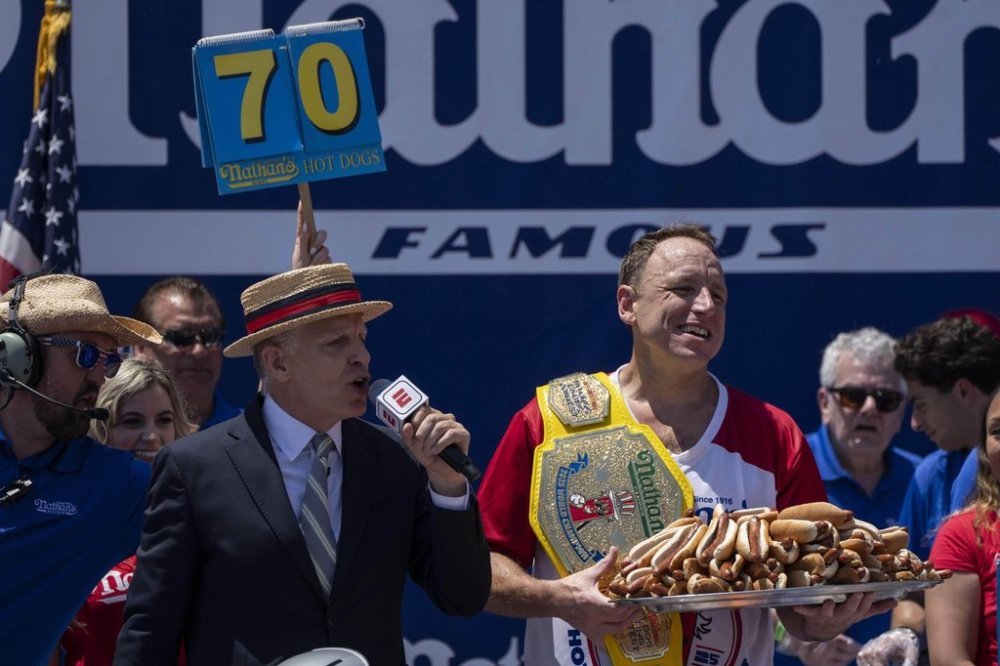 Competitive eater Joey Chestnut celebrates after winning the 2025 Nathan's Famous Fourth of July hot dog eating contest in the Coney Island section of the Brooklyn borough of New York, Thursday, July 4, 2025. (AP Photo/Yuki Iwamura)