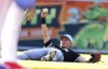 Chicago White Sox shortstop Colton Montgomery holds up the ball after fielding a short fly ball off the bat of Colorado Rockies' Ryan Ritter to end the second inning of a baseball game Friday, July 4, 2025, in Denver. (AP Photo/David Zalubowski)