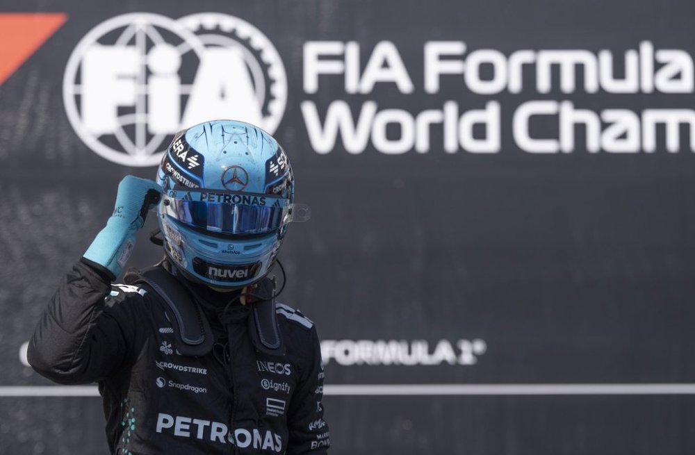 Mercedes driver George Russell, of the United Kingdom, celebrates after taking the pole in the qualifying session at the Canadian Grand Prix Saturday, June 14, 2025 in Montreal. THE CANADIAN PRESS/Christinne Muschi