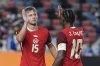 Canada forward Jonathan David (10) celebrates with defender Luc De Fougerolles (15) after scoring during a CONCACAF Gold Cup soccer match against El Salvador in Houston, Tuesday, June 24, 2025. (AP Photo/Ashley Landis)