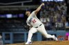 Los Angeles Dodgers pitcher Clayton Kershaw throws against Chicago White Sox's Vinny Capra during the sixth inning to strike him out for his 3,000th career strikeout Wednesday, July 2, 2025, in Los Angeles. (AP Photo/Kevork Djansezian)