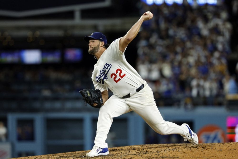 Los Angeles Dodgers pitcher Clayton Kershaw throws against Chicago White Sox's Vinny Capra during the sixth inning to strike him out for his 3,000th career strikeout Wednesday, July 2, 2025, in Los Angeles. (AP Photo/Kevork Djansezian)