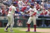 Philadelphia Phillies' Kyle Schwarber, right, celebrates with Alec Bohm after hitting a home run against Chicago Cubs pitcher Ben Brown during the third inning of a baseball game Wednesday, June 11, 2025, in Philadelphia. (AP Photo/Matt Slocum)