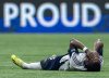 Vancouver Whitecaps' Sam Adekugbe (3) sits on the ground, eventually leaving the match against the Los Angeles Galaxy, during the first half of an MLS soccer match in Vancouver, B.C., Sunday, March 2, 2025. THE CANADIAN PRESS/Ethan Cairns