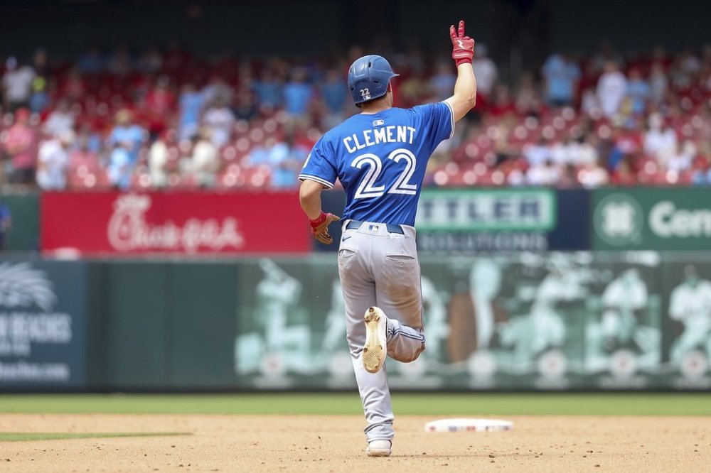 Toronto Blue Jays' Ernie Clement gestures skyward as he runs the bases after hitting a solo home run during the fifth inning of a baseball game against the St. Louis Cardinals, Wednesday, June 11, 2025, in St. Louis. (AP Photo/Scott Kane)