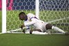 France's Ousmane Dembele is on the grass beside the goal during the Nations League semifinal soccer match between Spain and France at the MHPArena, in Stuttgart, Germany, Thursday, June 5, 2025. (AP Photo/Martin Meissner)