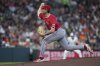 FILE - Los Angeles Angels pitcher Michael Darrell-Hicks (61) pitches during the seventh inning of a baseball game against the Houston Astros, April 13, 2025, in Houston. (AP Photo/Kevin M. Cox, File)
