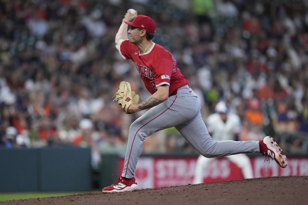 FILE - Los Angeles Angels pitcher Michael Darrell-Hicks (61) pitches during the seventh inning of a baseball game against the Houston Astros, April 13, 2025, in Houston. (AP Photo/Kevin M. Cox, File)