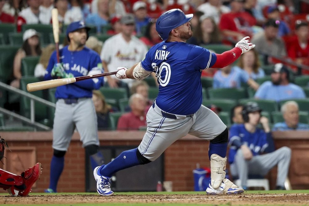 Toronto Blue Jays' Alejandro Kirk hits an RBI double during the 10th inning of a baseball game against the St. Louis Cardinals, Monday, June 9, 2025, in St. Louis. (AP Photo/Scott Kane)