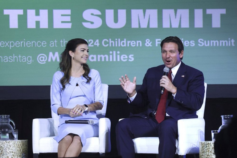FILE - Florida first lady Casey DeSantis listens to Gov. Ron DeSantis during a panel discussion at the 2024 Florida Children and Families Summit at the JW Marriott Grand Lakes in Orlando, Fla., Sept. 4, 2024. (Joe Burbank/Orlando Sentinel via AP, File)