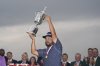 J.J. Spaun celebrates with the trophy after winning the U.S. Open golf tournament at Oakmont Country Club Sunday, June 15, 2025, in Oakmont, Pa. (AP Photo/Seth Wenig)