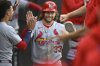 St. Louis Cardinals' Brendan Donovan (33) celebrates in the dugout with teammates after scoring on a Ivan Herrera two-RBI single during the second inning of a baseball game against the Chicago White Sox, Tuesday, June 17, 2025, in Chicago. (AP Photo/Paul Beaty)