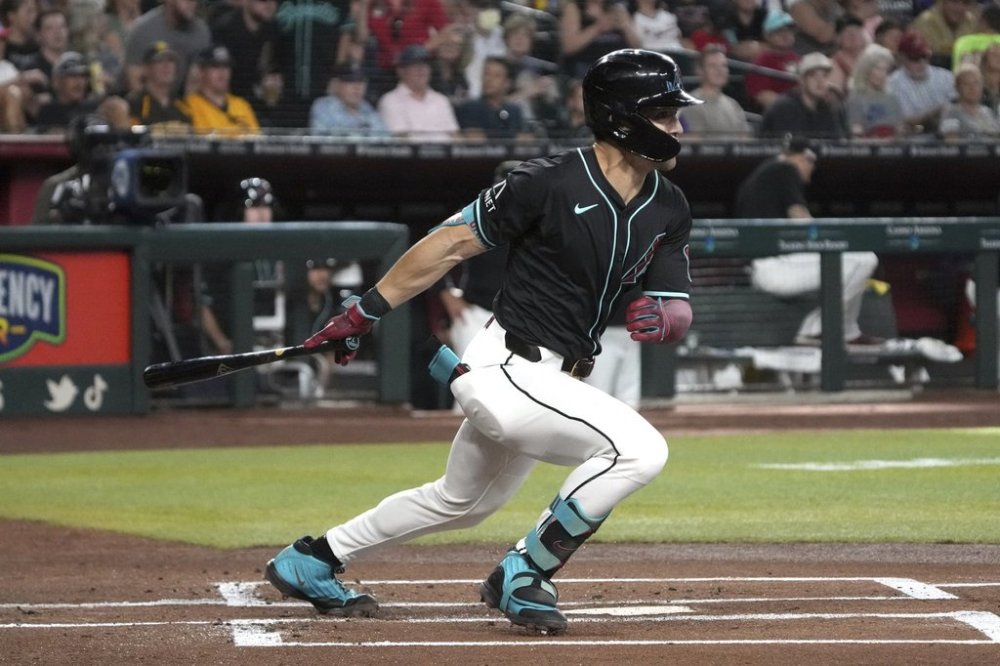 Arizona Diamondbacks' Corbin Carroll hits against the San Diego Padres in the first inning during a baseball game, Saturday, June 14, 2025, in Phoenix. (AP Photo/Rick Scuteri)