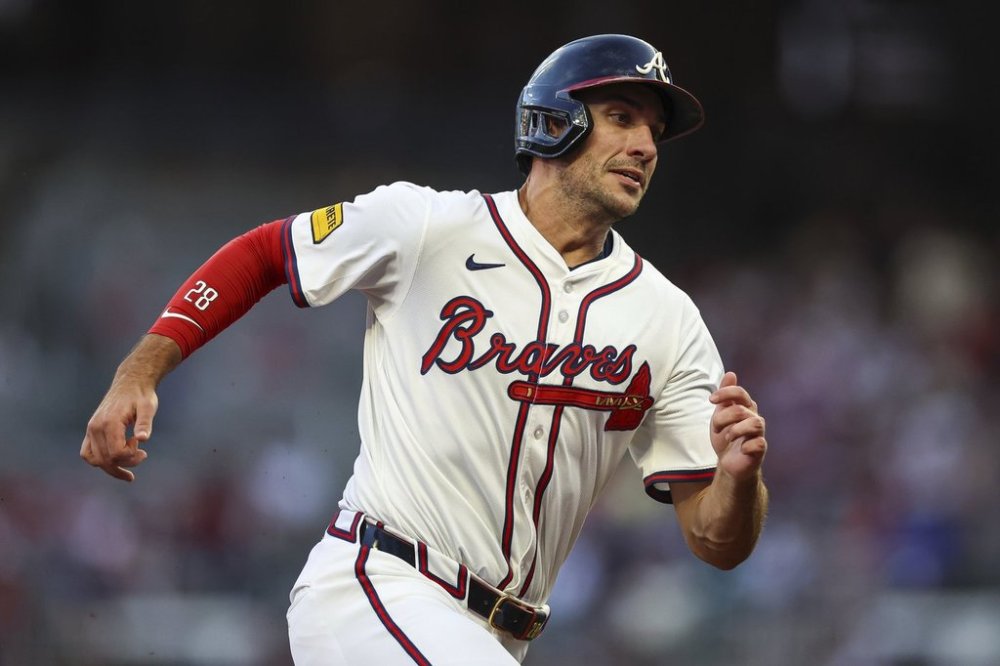 Atlanta Braves' Matt Olson rounds third base before scoring a run in the fourth inning of a baseball game against the New York Mets, Thursday, June 19, 2025, in Atlanta. (AP Photo/Colin Hubbard)