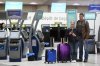 Passengers are seen in the WestJet check-in area at Pearson International Airport, in Toronto, Saturday, June 29, 2024. THE CANADIAN PRESS/Christopher Katsarov
