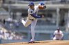 Los Angeles Dodgers starting pitcher Shohei Ohtani follows through on a throw to a Washington Nationals batter during the first inning of a baseball game in Los Angeles, Sunday, June 22, 2025. (AP Photo/Jessie Alcheh)