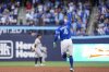 Toronto Blue Jays' George Springer (4) celebrates his two-run home run against the New York Yankees during third inning MLB baseball action, in Toronto on Thursday, July 3, 2025. THE CANADIAN PRESS/Thomas Skrlj