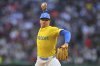 Boston Red Sox's Hunter Dobbins delivers a pitch to a New York Yankees batter in the first inning of a baseball game, Saturday, June 14, 2025, in Boston. (AP Photo/Steven Senne)