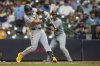 Pittsburgh Pirates' Nick Gonzales hits an RBI single during the fifth inning of a baseball game against the Milwaukee Brewers, Monday, June 23, 2025, in Milwaukee. (AP Photo/Aaron Gash)