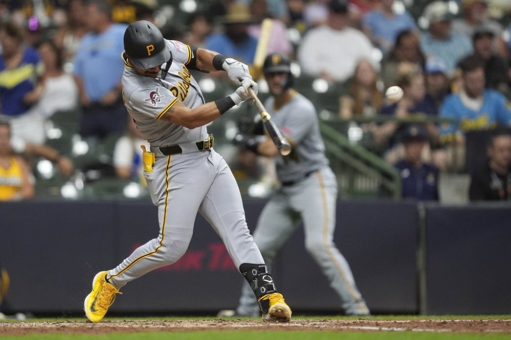 Pittsburgh Pirates' Nick Gonzales hits an RBI single during the fifth inning of a baseball game against the Milwaukee Brewers, Monday, June 23, 2025, in Milwaukee. (AP Photo/Aaron Gash)