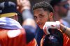 Houston Astros' Jeremy Peña celebrates with teammates after hitting a home run during the fifth inning of a baseball game against the Los Angeles Angels, Sunday, June 22, 2025, in Anaheim, Calif. (AP Photo/William Liang)