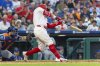 Philadelphia Phillies' Kyle Schwarber hits a solo home run during the fourth inning of a baseball game against the New York Mets, Sunday, June 22, 2025, in Philadelphia. (AP Photo/Laurence Kesterson)