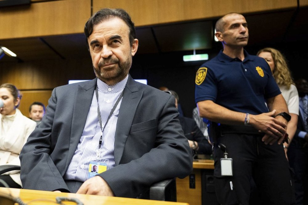 Iran's Ambassador to the International Atomic Energy Agency, IAEA, Reza Najafi, left, attends an IAEA Board of Governors meeting in Vienna, Austria, Monday, June 23, 2025. (AP Photo/Michael Gruber)