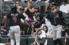 Arizona Diamondbacks' Ketel Marte (4) celebrates with Pavin Smith after hitting a solo home run during the first inning of a baseball game against the Chicago White Sox in Chicago, Tuesday, June 24, 2025. (AP Photo/Nam Y. Huh)