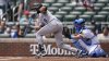 Colorado Rockies' Ryan Ritter (8) bunts against the Atlanta Braves in the third inning of a baseball game, Sunday, June 15, 2025, in Atlanta. (AP Photo/Mike Stewart)