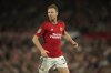 FILE - Manchester United's Jonny Evans runs during the English League Cup third round soccer match against Crystal Palace at Old Trafford stadium in Manchester, England, Sept. 26, 2023. (AP Photo/Dave Thompson, file)