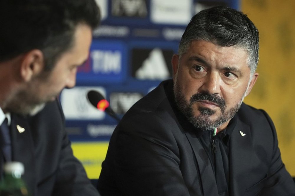 Newly appointed Italian national soccer team head coach Rino Gattuso, right, holds a press conference, in Rome, Thursday, June 19, 2025. (AP Photo/Alessandra Tarantino)