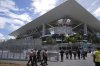 Law enforcement personnel walk outside Hard Rock Stadium during preparations for Saturday's opening match in the Club World Cup soccer tournament, Wednesday, June 11, 2025, in Miami Gardens, Fla. (AP Photo/Rebecca Blackwell)