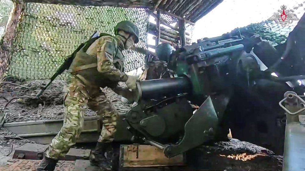 In this photo taken from video distributed by Russian Defense Ministry Press Service on Tuesday, June 24, 2025, a Russian soldier prepares Giatsint-B 152 mm field gun to fire towards Ukrainian position on an undisclosed location in Ukraine. (Russian Defense Ministry Press Service via AP)