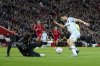FILE - Liverpool's goalkeeper Alisson falls on the ground as West Ham's Nikola Vlasic, right, makes an unsuccessful attempt to score a goal during the English Premier League soccer match between Liverpool and West Ham United at Anfield stadium in Liverpool, England, Saturday, March 5, 2022. (AP Photo/Jon Super, file)